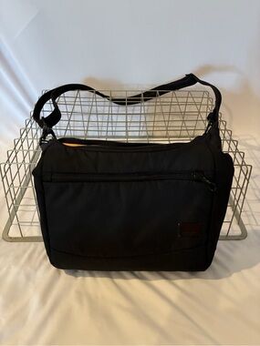 Pacsafe Black Travel Crossbody Bag with Front Zip Pocket and Adjustable Straps